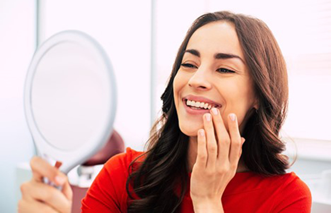 a person smiling after receiving cosmetic dentistry 