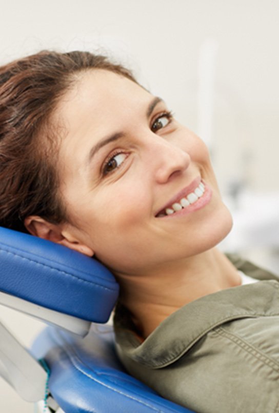 a patient smiling before her dental appointment
