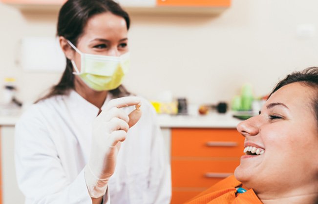 a patient smiling after her dental appointment