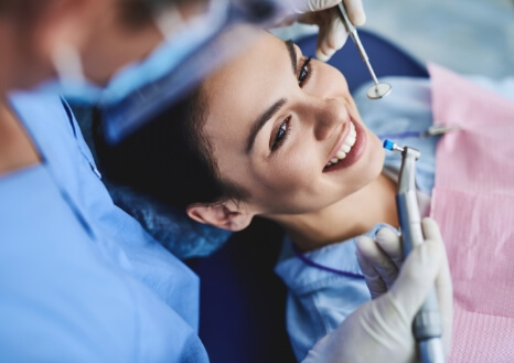 Doctor Ong talking to dental patient