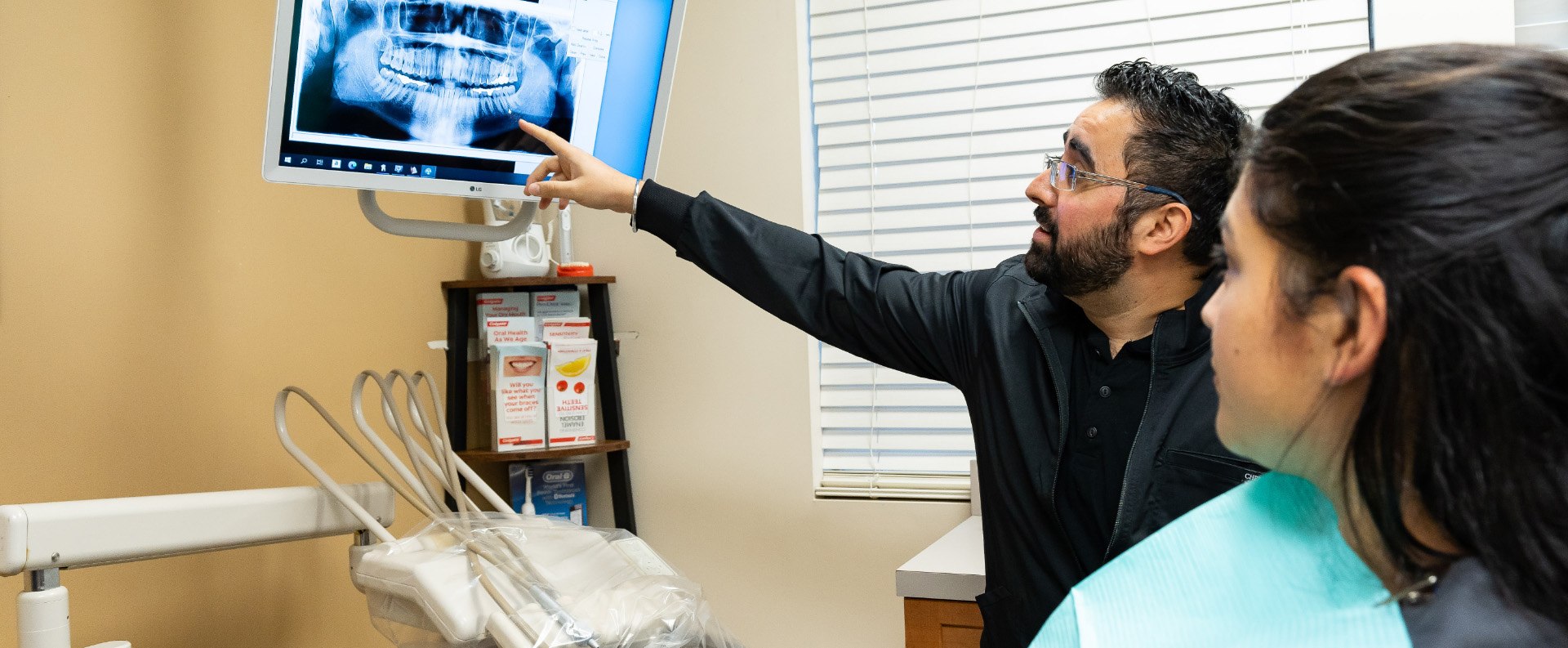 Dental patient and dentist in Renton Washington looking at digital x rays