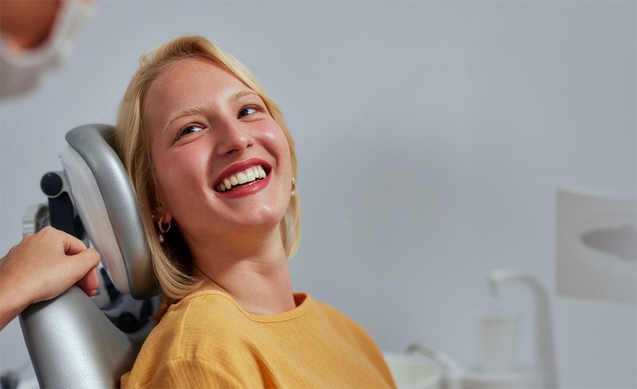 Smiling woman in dental chair