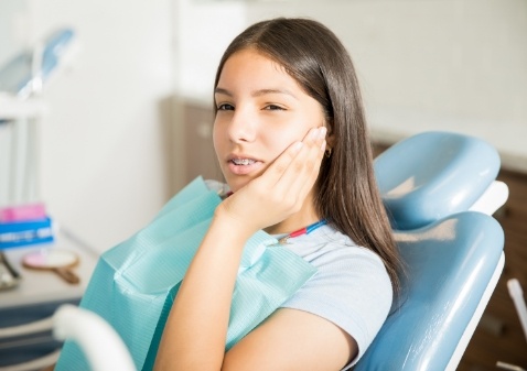 Dental team member working with dental equipment