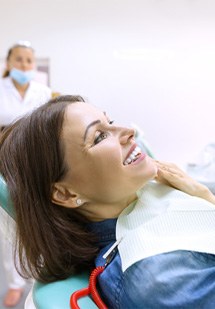 Patient putting on their Invisalign