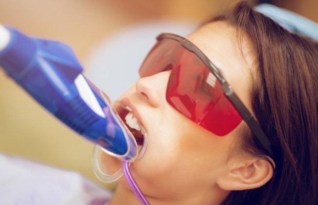 Dental patient receiving fluoride treatment