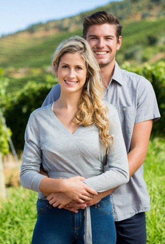 Man and woman smiling outdoors