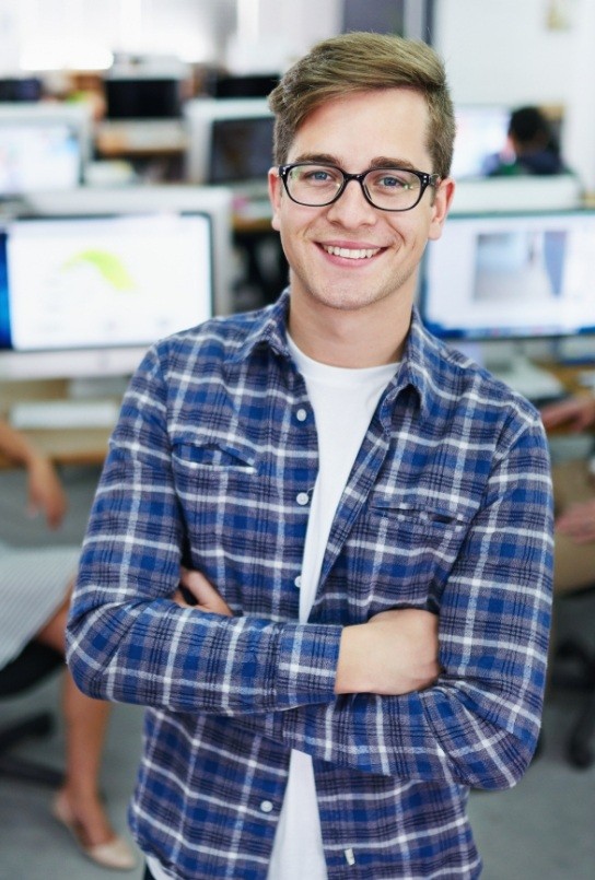 Young man with healthy smile after tooth extractions