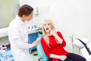 a patient visiting their dentist for wisdom tooth removal